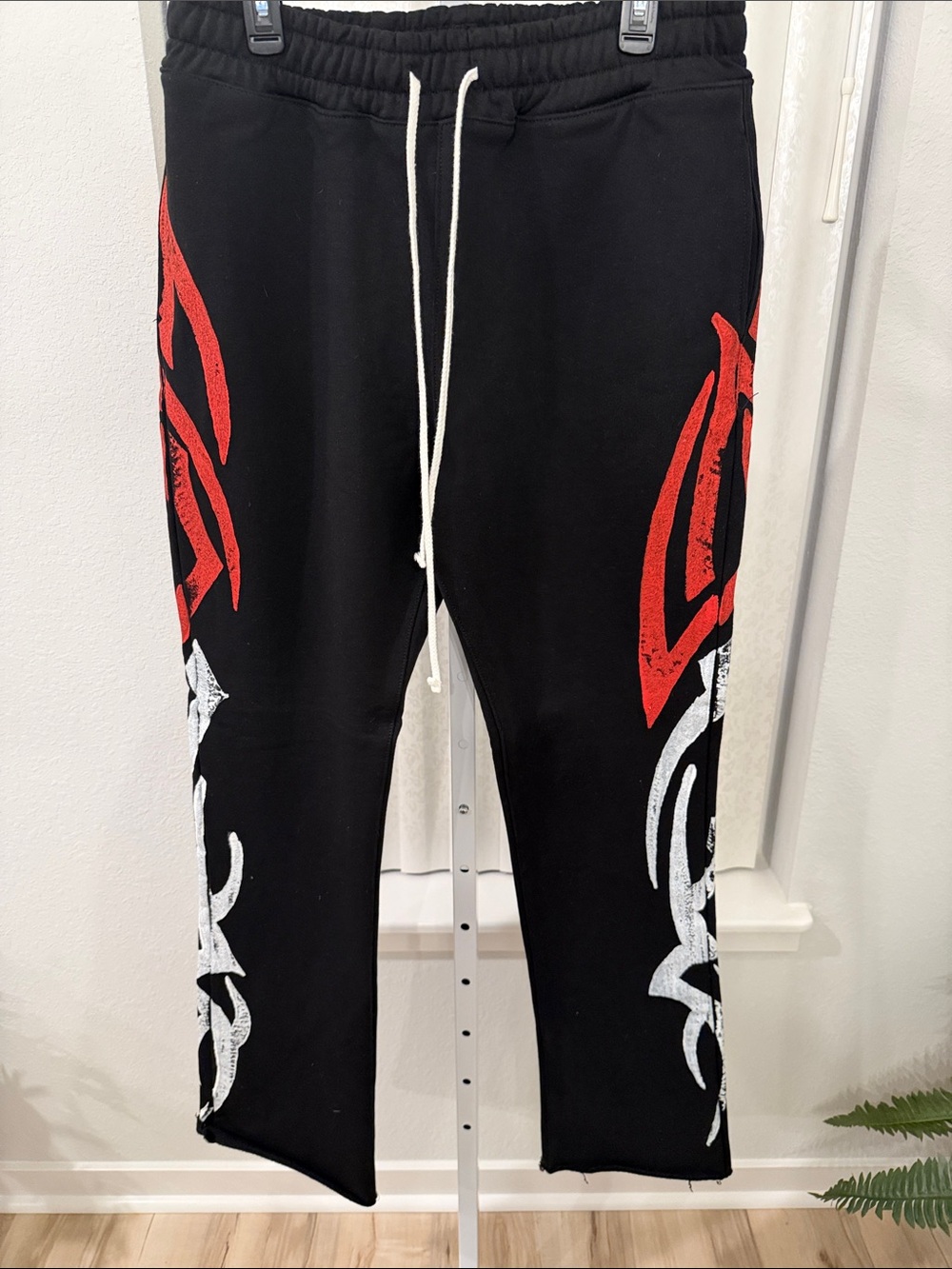 Black Men's Graphic Sweatpants with Red & White Tribal Print